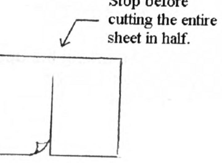 A sheet of paper with a slit cut partway down the middle, labeled to stop before cutting the sheet entirely in half